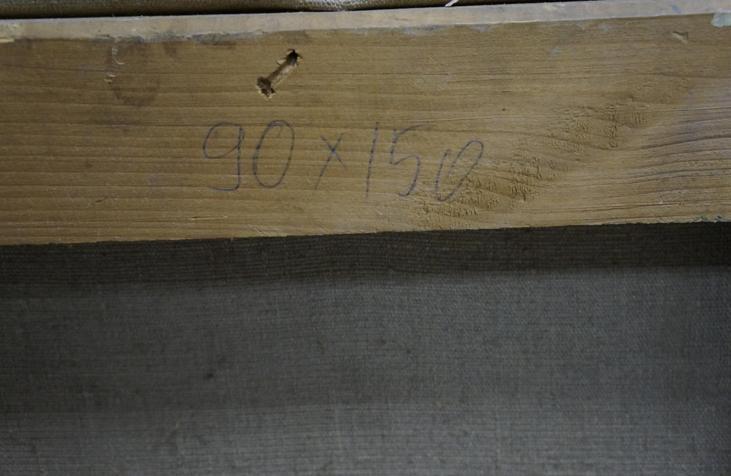 Back of oil painting by Bednoshey Daniil Panteleyevich: light brown wooden beam with grain and screw hole