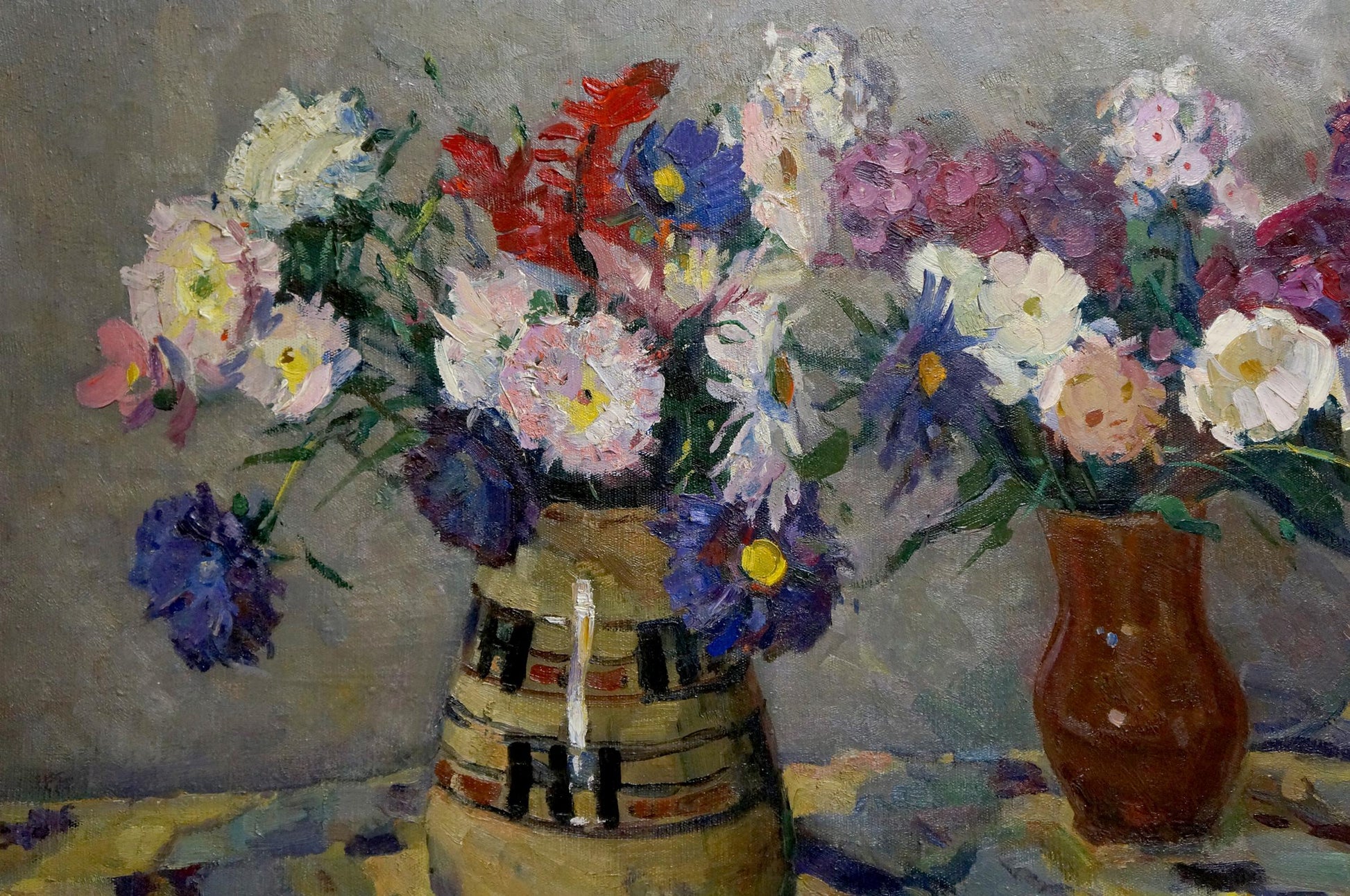 Oil painting of vibrant mixed flowers in striped earth-toned vase by Kosyak Aleksandr Borisovich