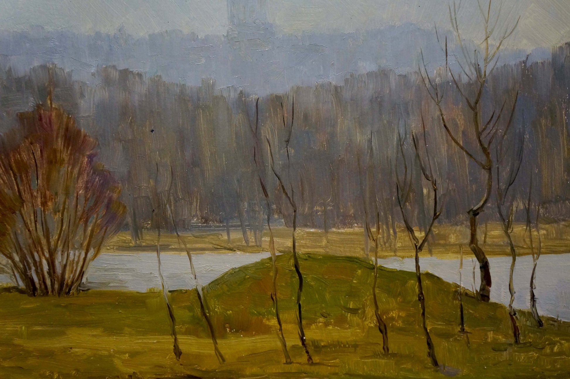 Oil painting of muted autumn landscape with bare trees, church bells, cityscape and water in earthy tones. Unknown artist