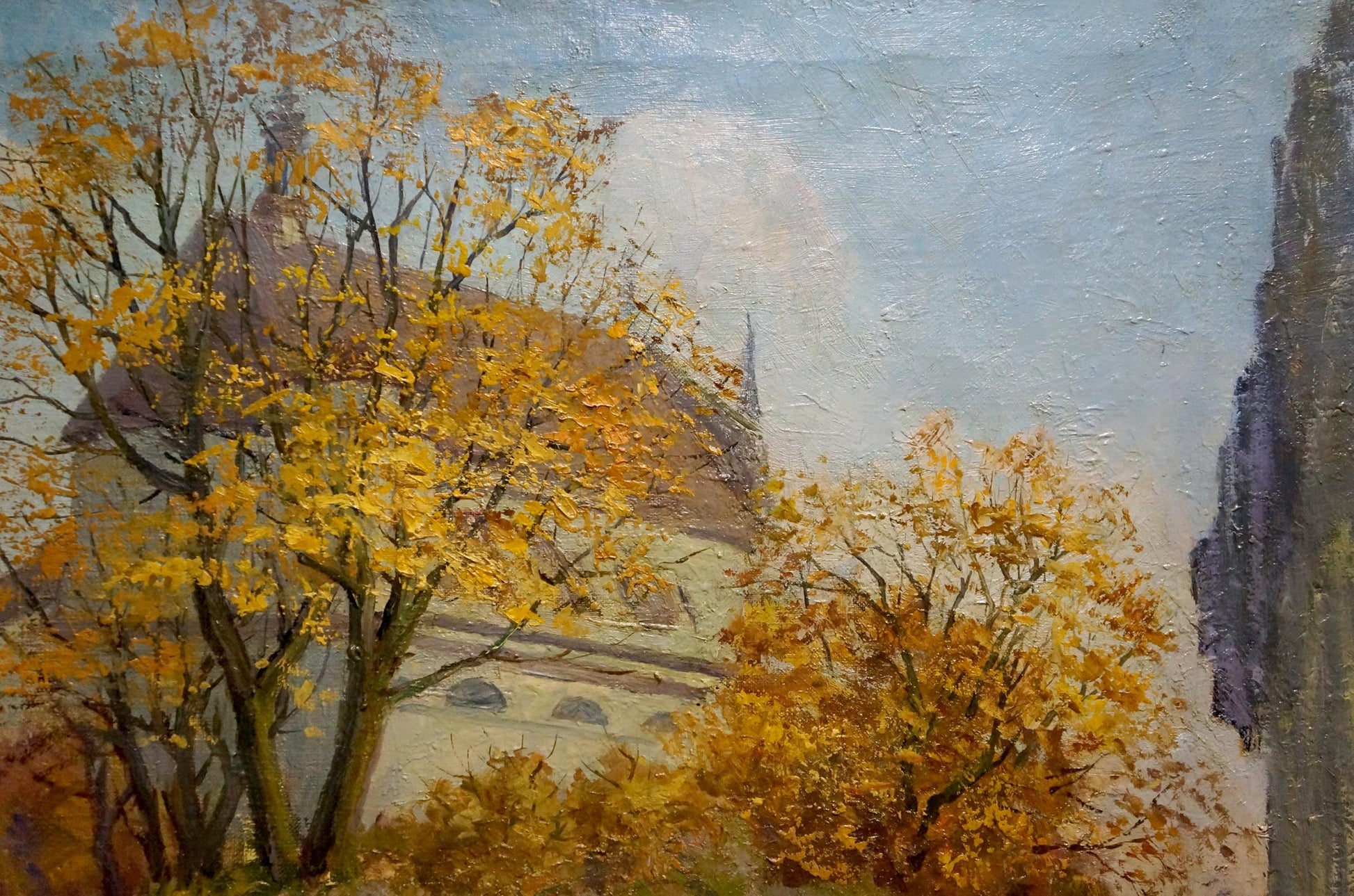 Oil painting by Rudenko Vladimir Mikhailovich: autumn trees frame city center