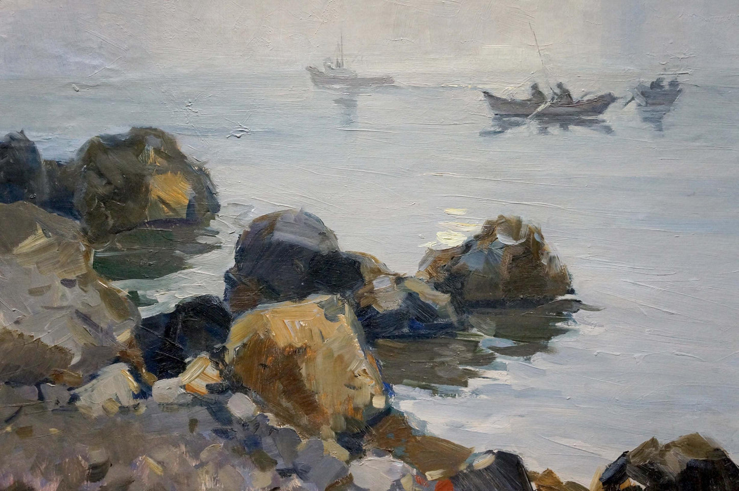 Textured oil painting of rugged shoreline rocks, misty sea, and distant fishing boats