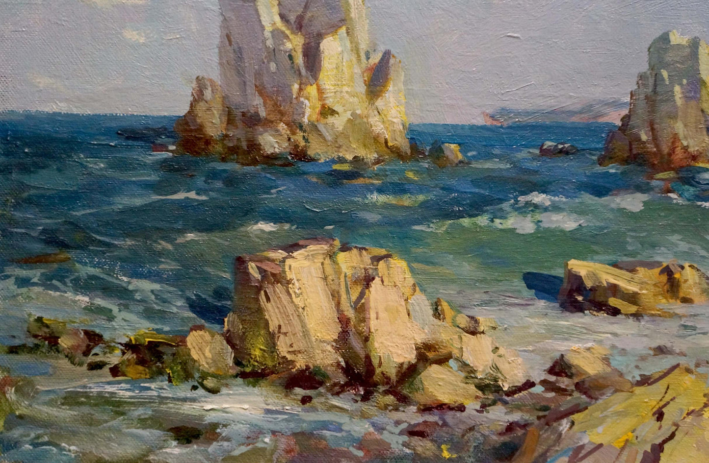 Oil painting By the Sea by Levichev H.V.: sunlit coastal rocks in turbulent waters