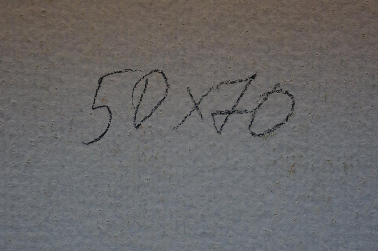 Black chalk markings on gray wall textured back of Olkhov lilac blooms painting