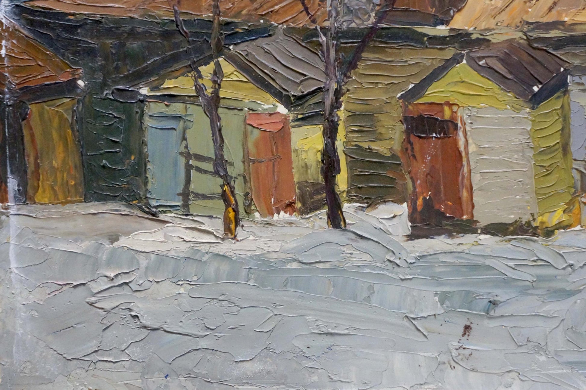 Oil painting of snowy village street with colorful wooden houses
