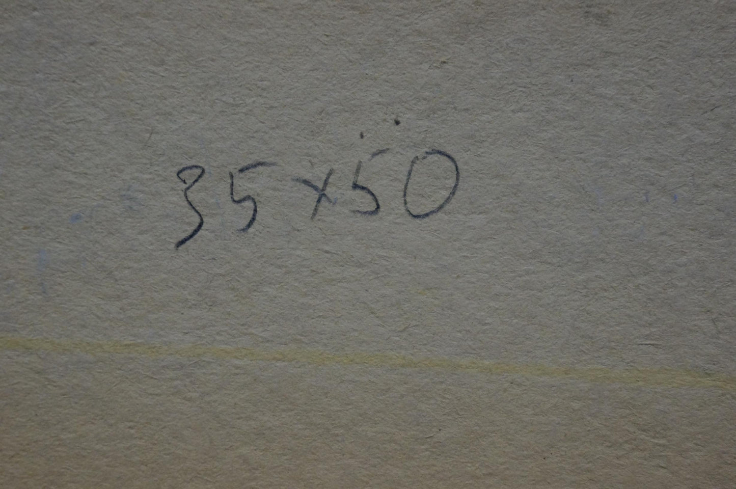 Back of oil painting Urban landscape with 35x50 inch handwritten measurement markings on textured gray wall