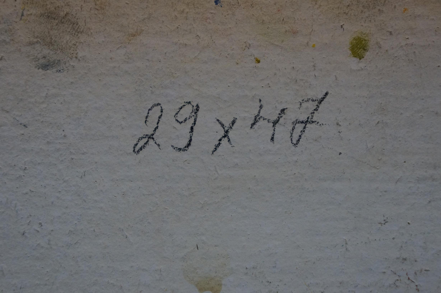 Back of Sea Khodchenko Lev Pavlovich oil painting with 29 x 47 in marker notation on textured wall
