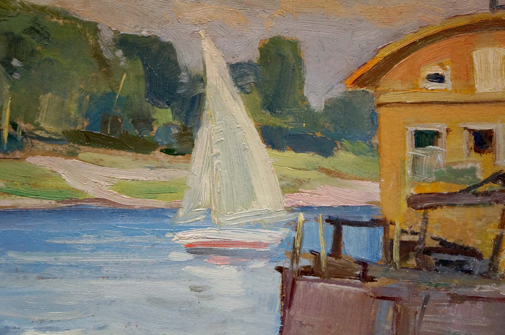 Oil painting by Nikolay Ivanovich Buryachok: white sailboat with red hull on blue water near yellow building