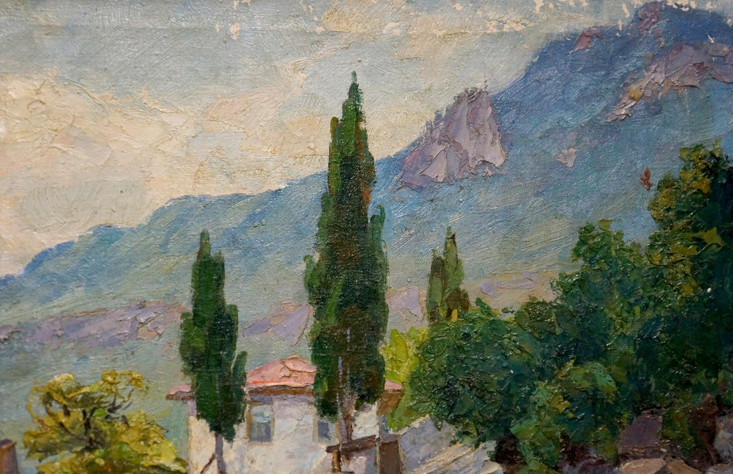 Oil painting of house by the shore with cypress trees and mountains
