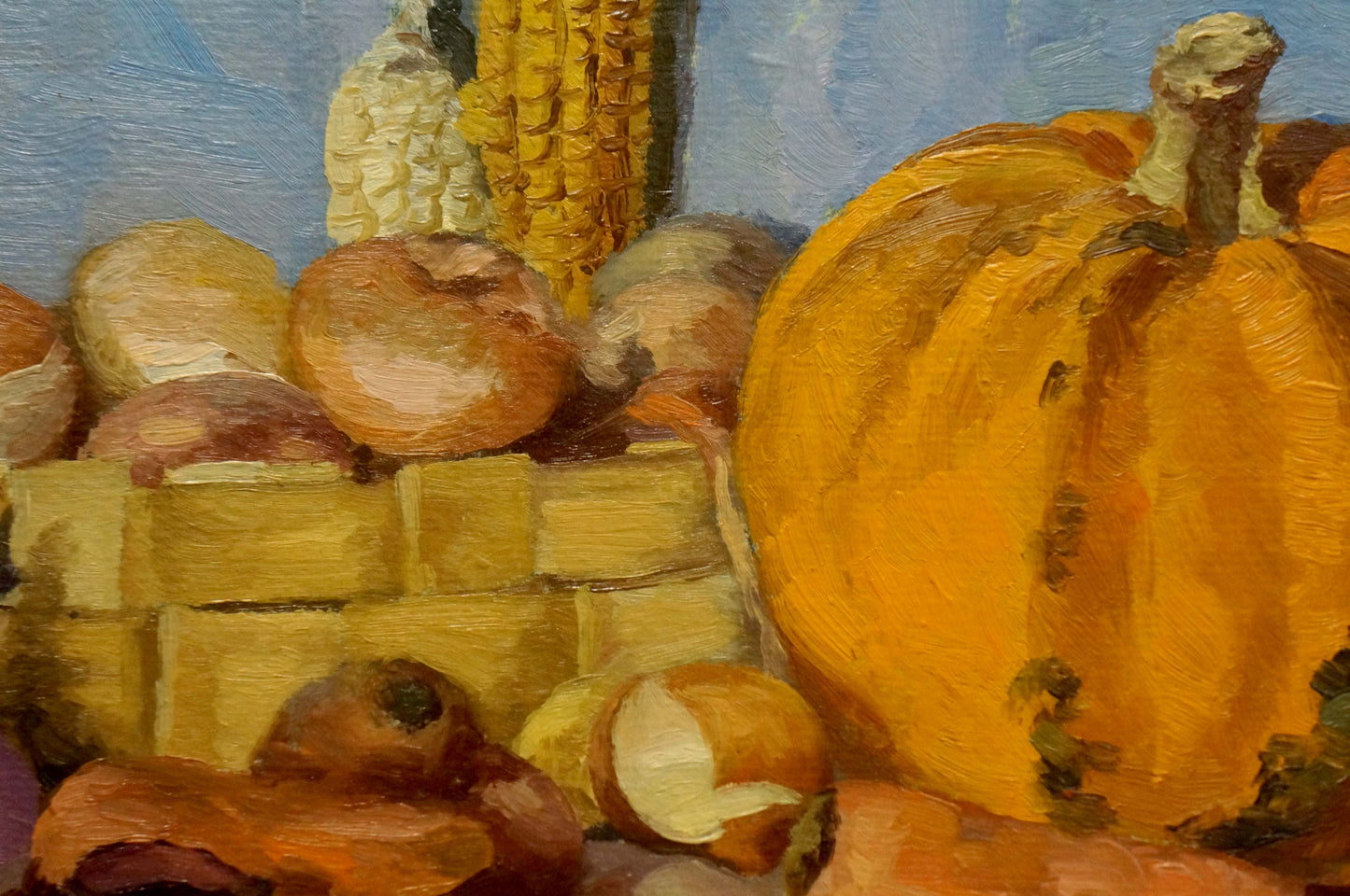 Oil painting of vibrant orange pumpkin with bumpy texture and green stem
