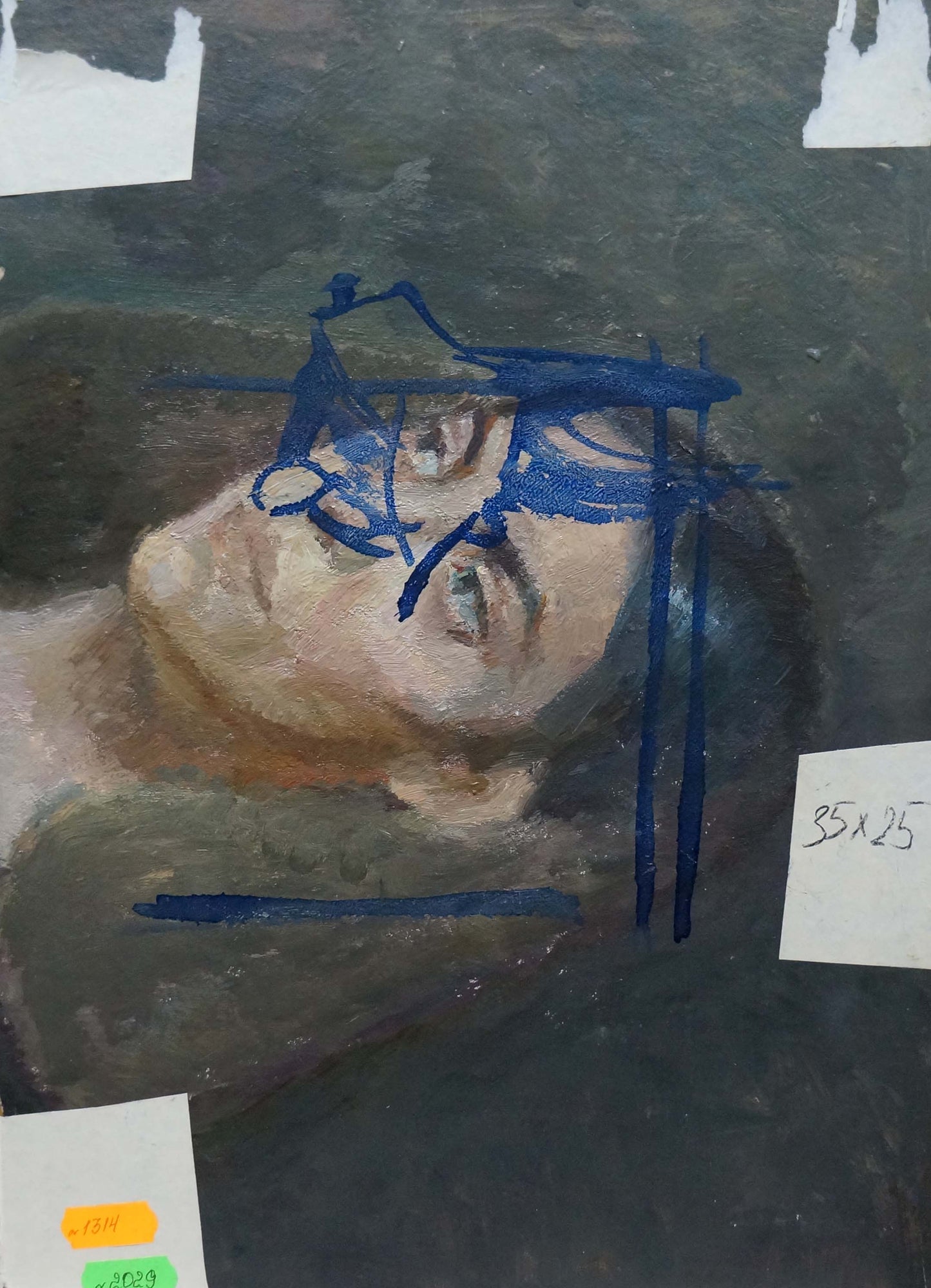Partially completed oil painting of womans face with blue sketch lines