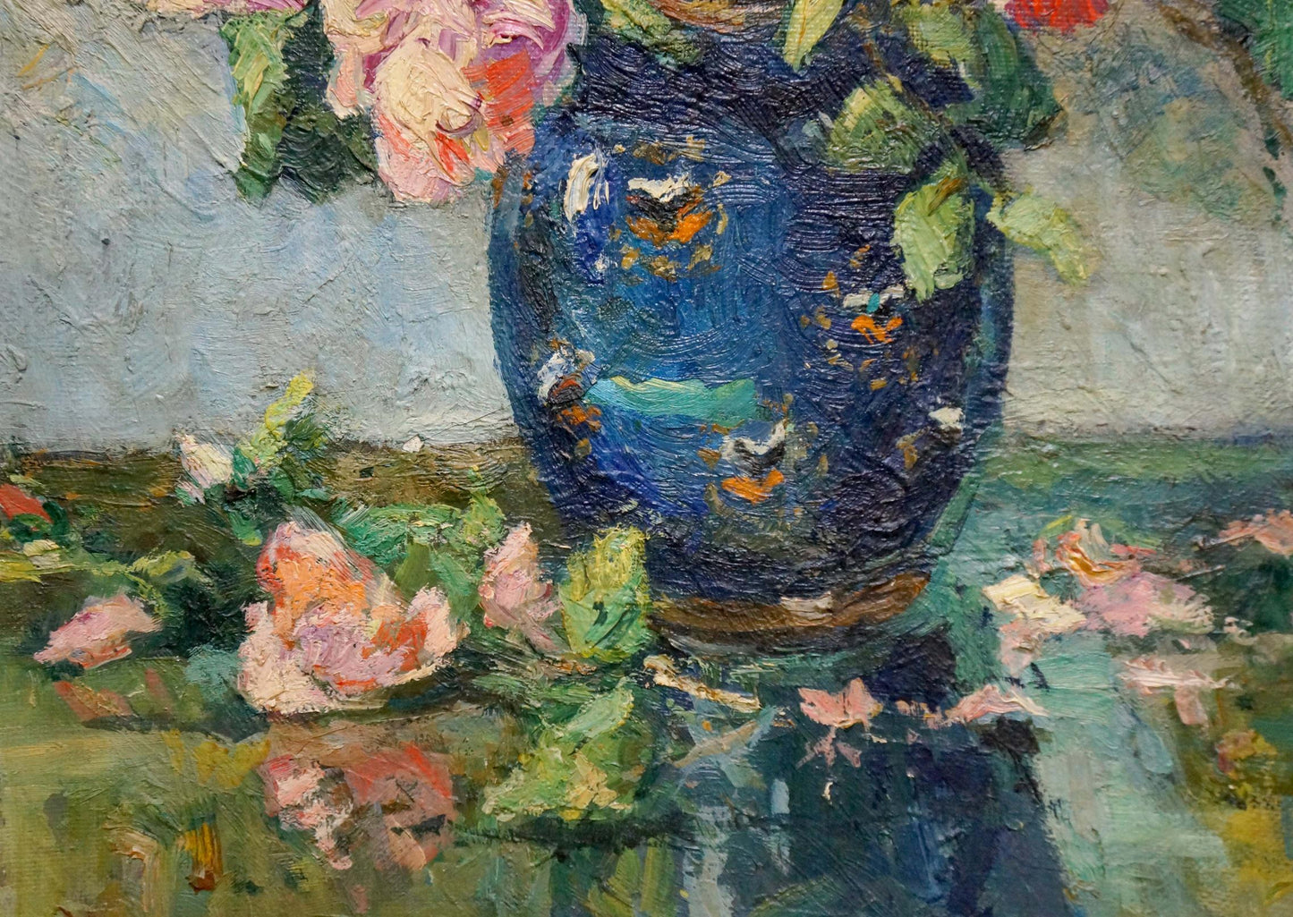 Deep blue ceramic vase with gold green patterns holding pink roses by Hitrova Tamara Aleksandrovna