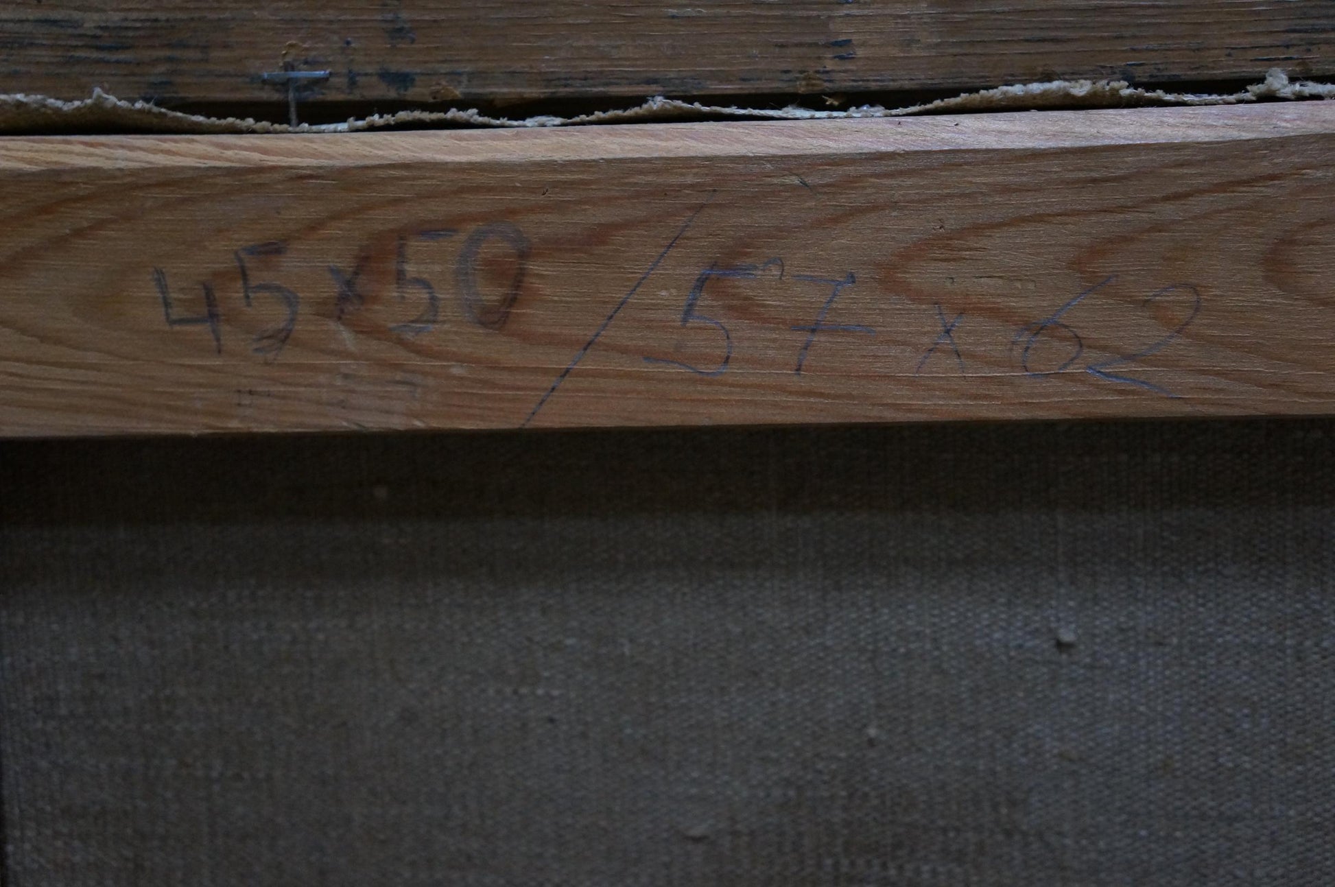 Back of oil painting by Dmitry Georgievich Salov: light brown wooden beam with handwritten measurements
