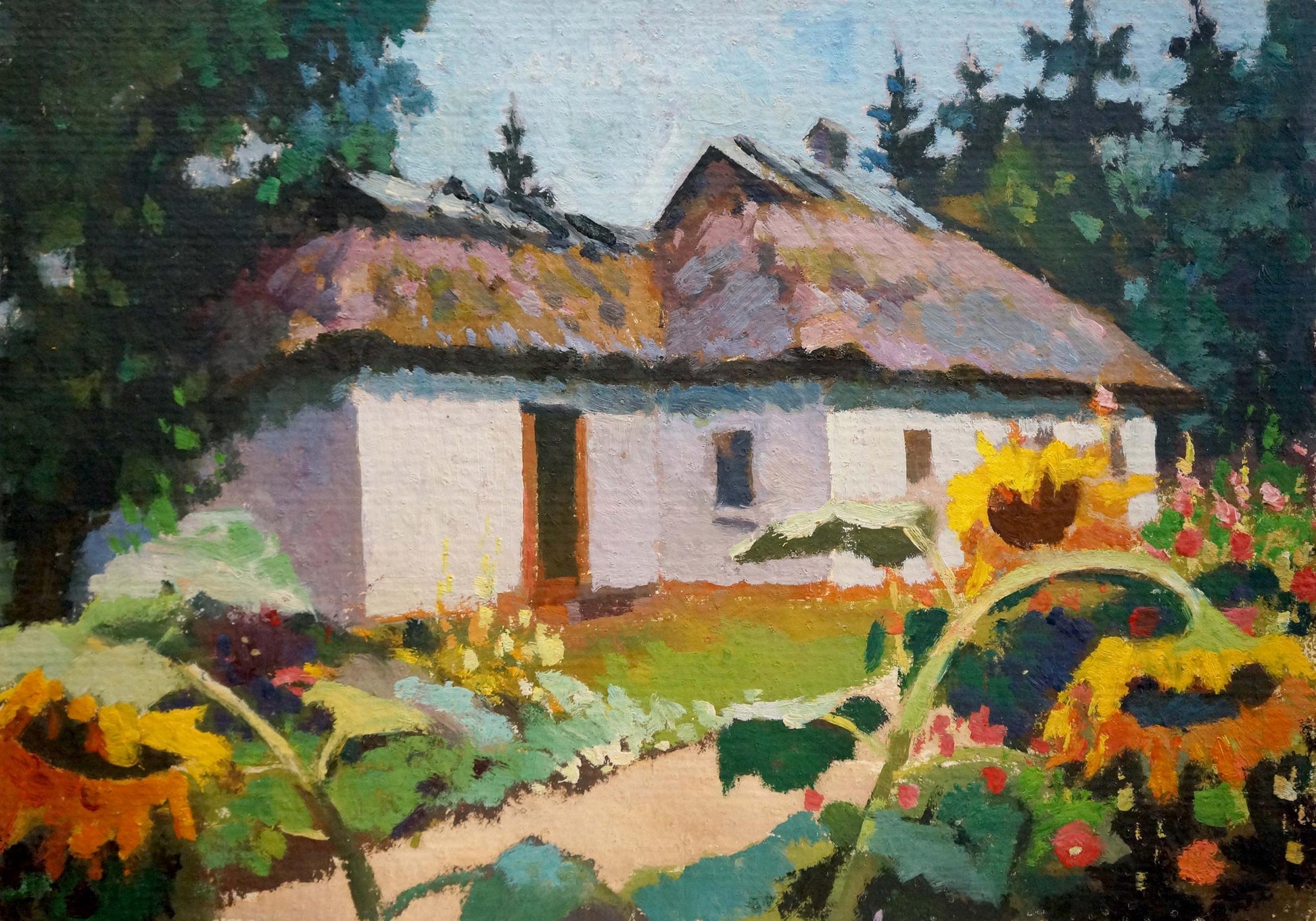 Oil painting of rustic white thatched cottage in sunflower courtyard