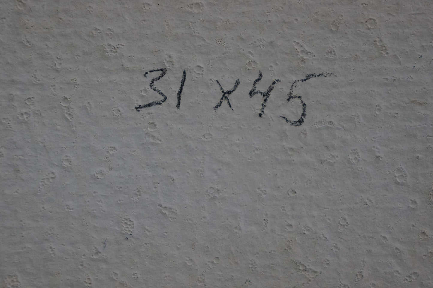 Back of Oil painting Courtyard landscape with 31 x 45 inch dimensions handwritten in black on textured gray wall