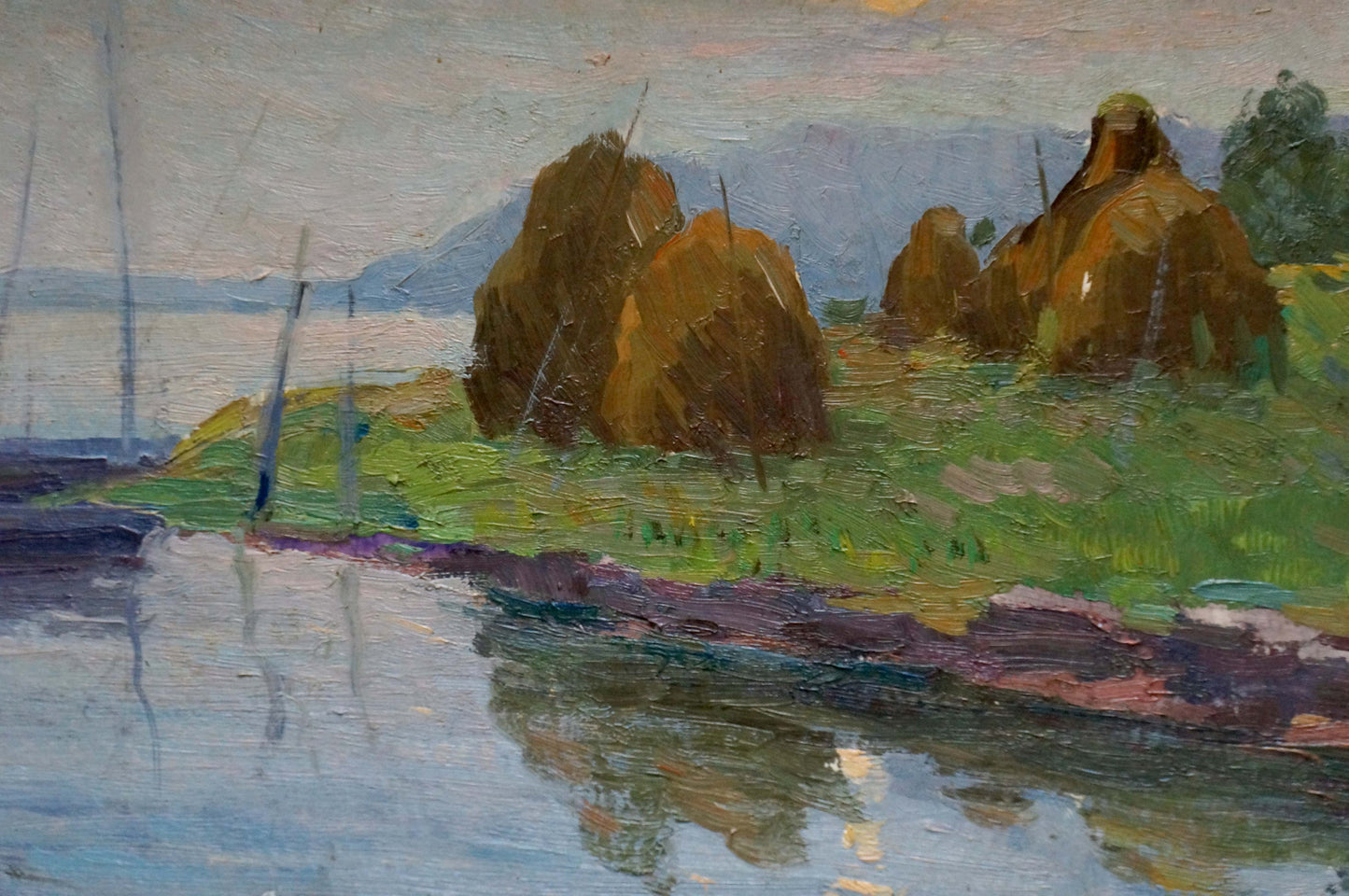 Oil painting by Stremsky Alexander Ivanovich: golden hay bales near shore