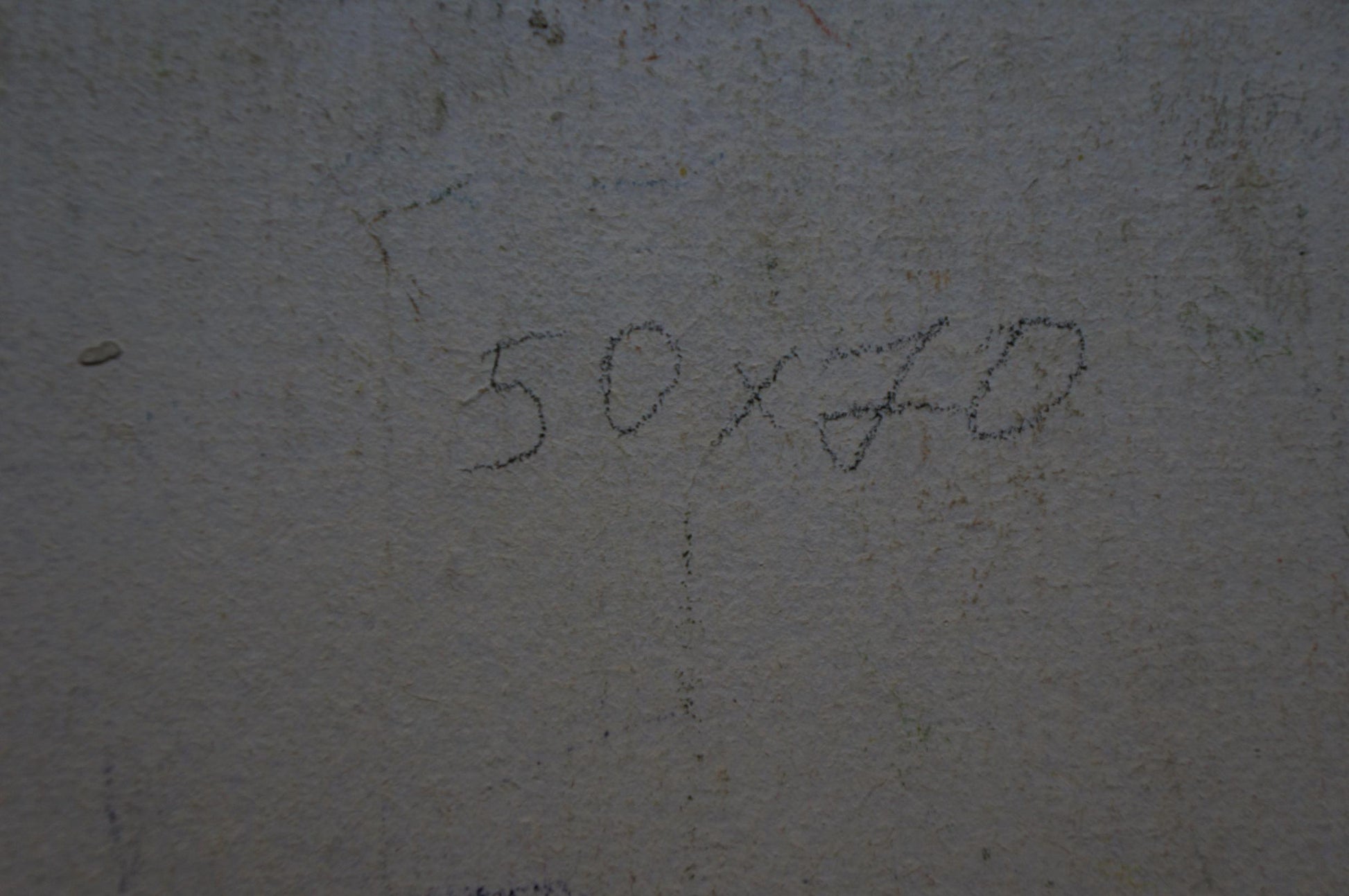 Back of Olkhov Vladimir Nikolaevich oil painting with 50x70 handwritten on gray concrete