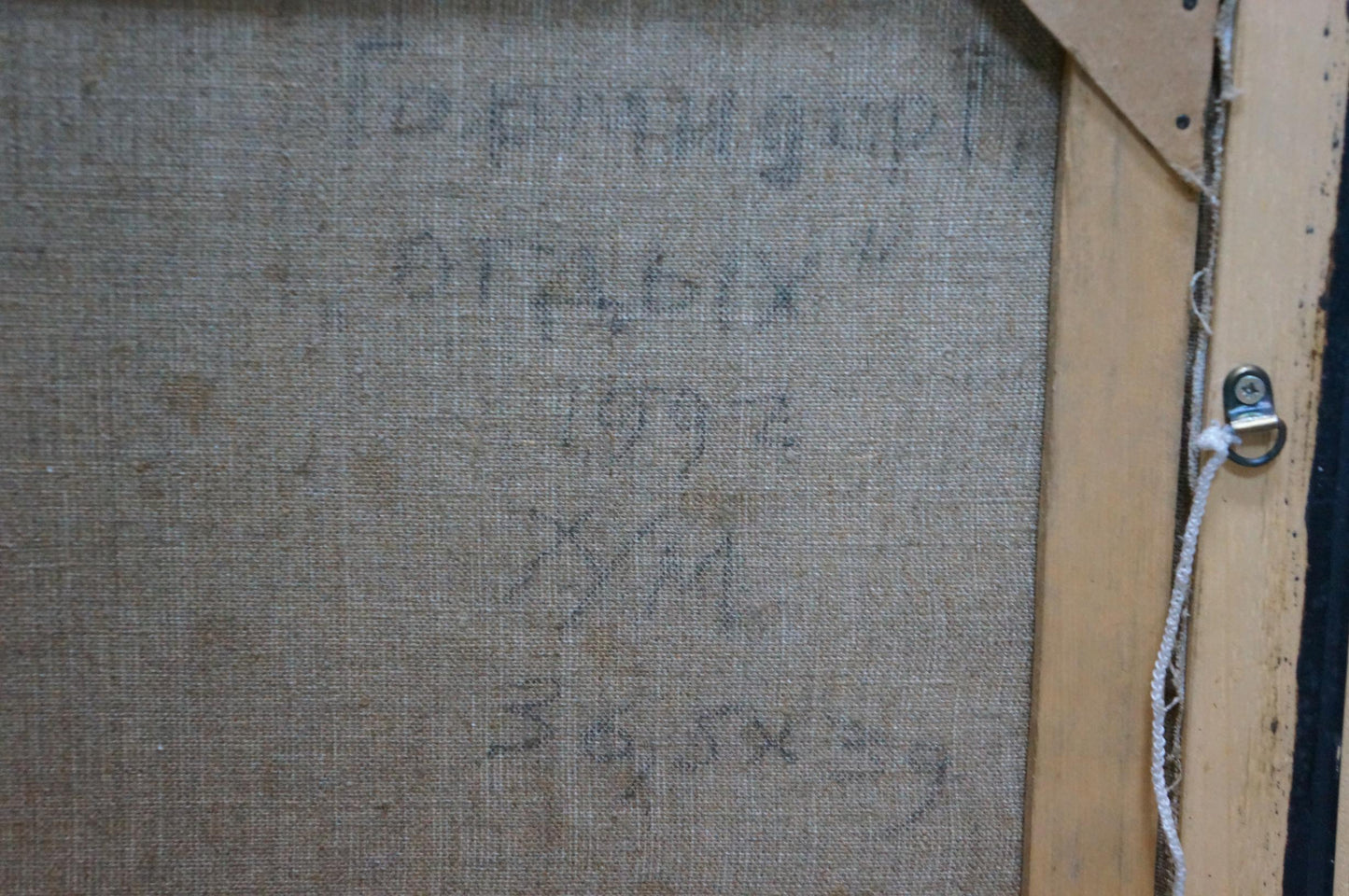 Back of framed oil painting Man is resting by Garmider Gennady Vasilievich with faded Cyrillic text on linen