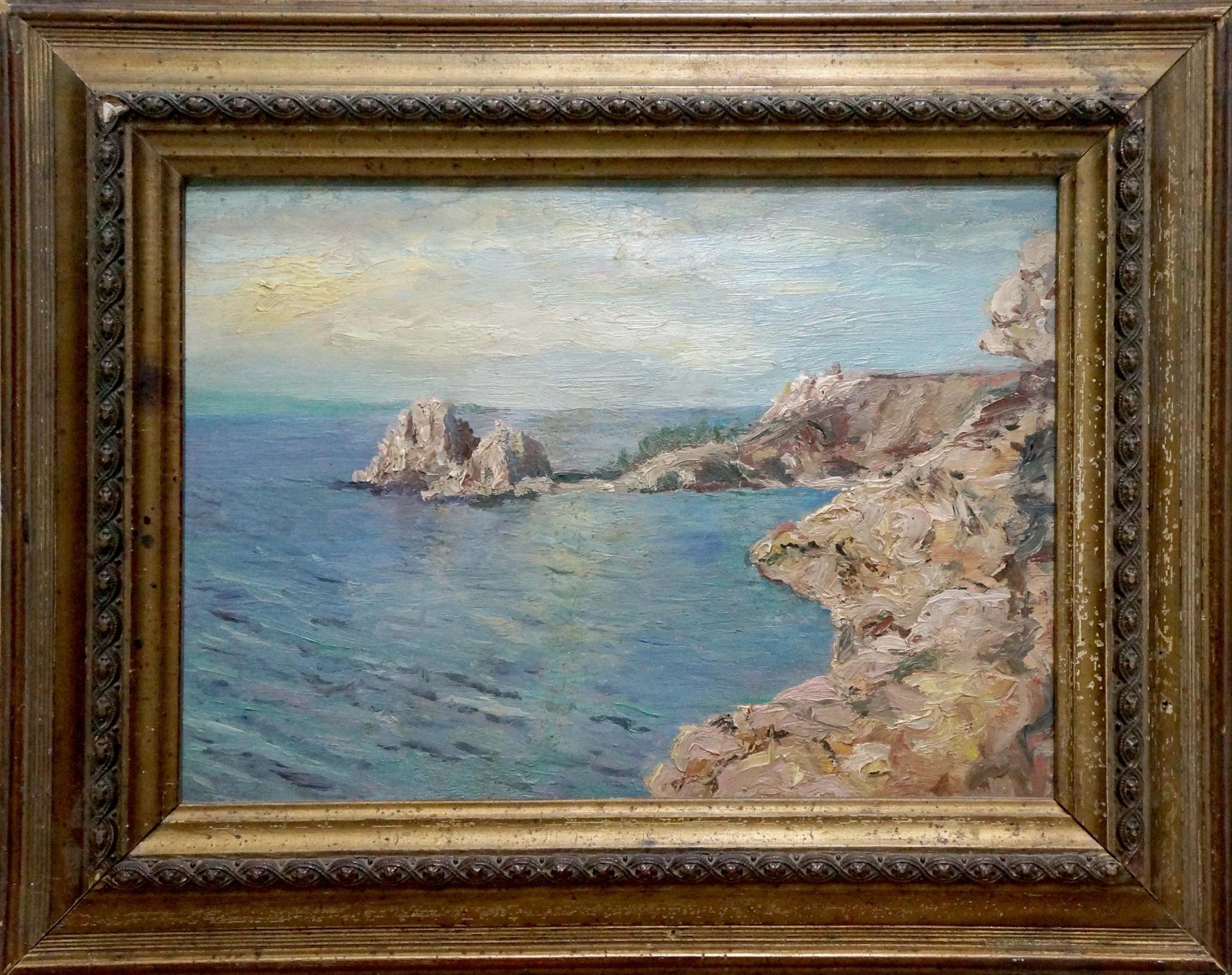 Antique gold-framed oil painting of coastal cliffs and sea by unknown artist