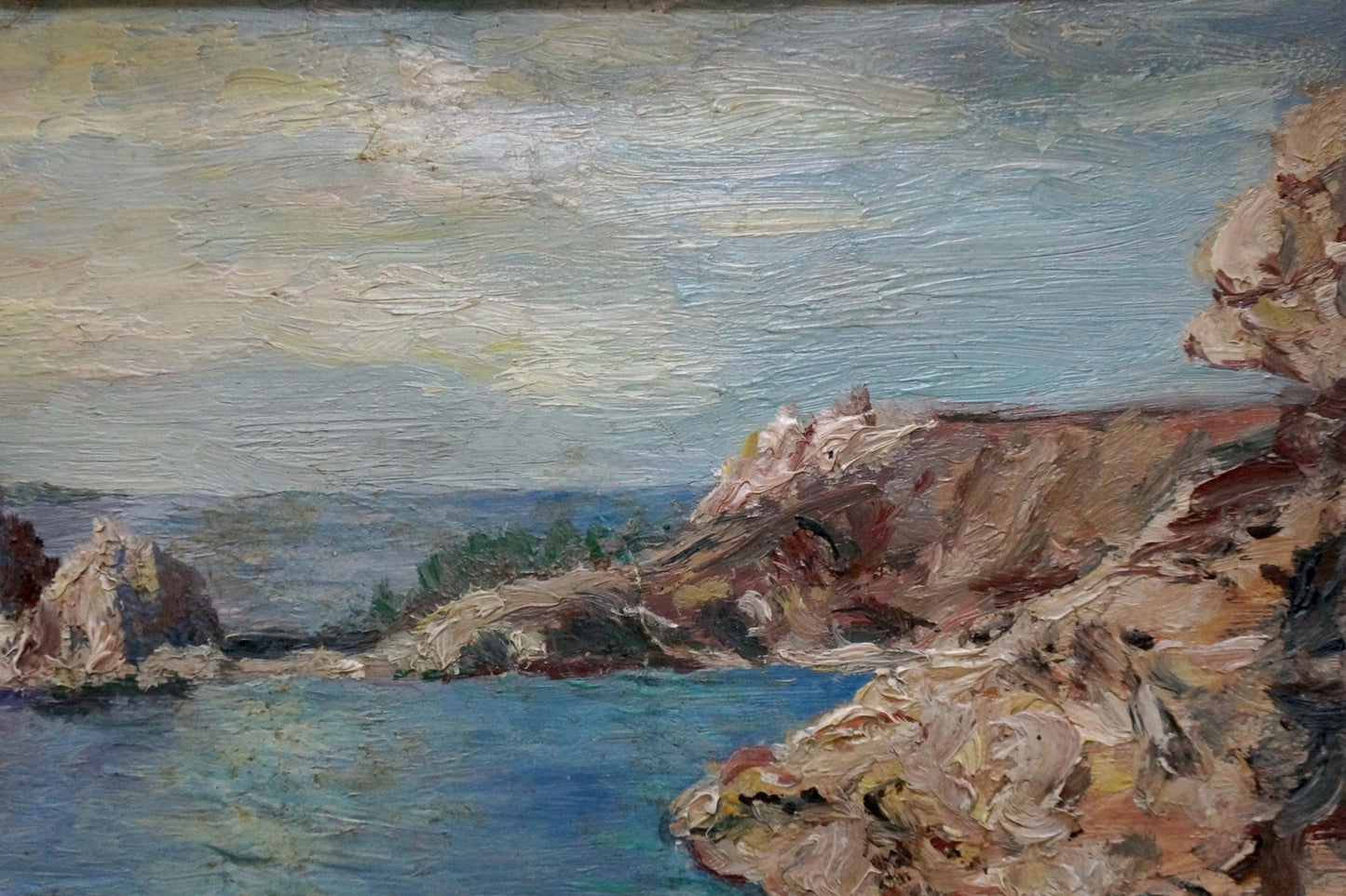 Oil painting of sea and sun among clouds, coastal cliffs by unknown artist