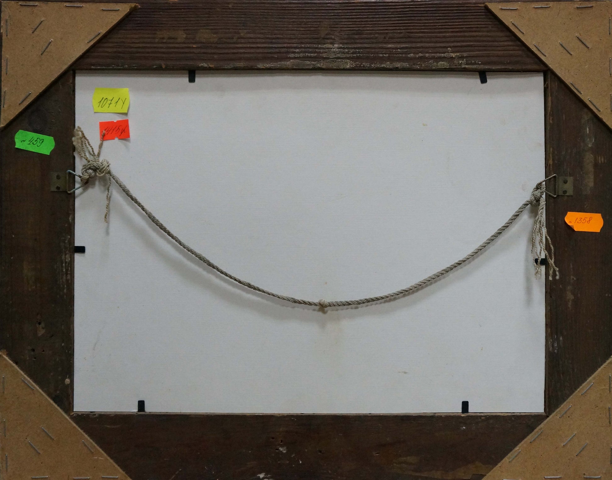 Back of oil painting frame with thick gray braided rope, Sea and sun among the clouds