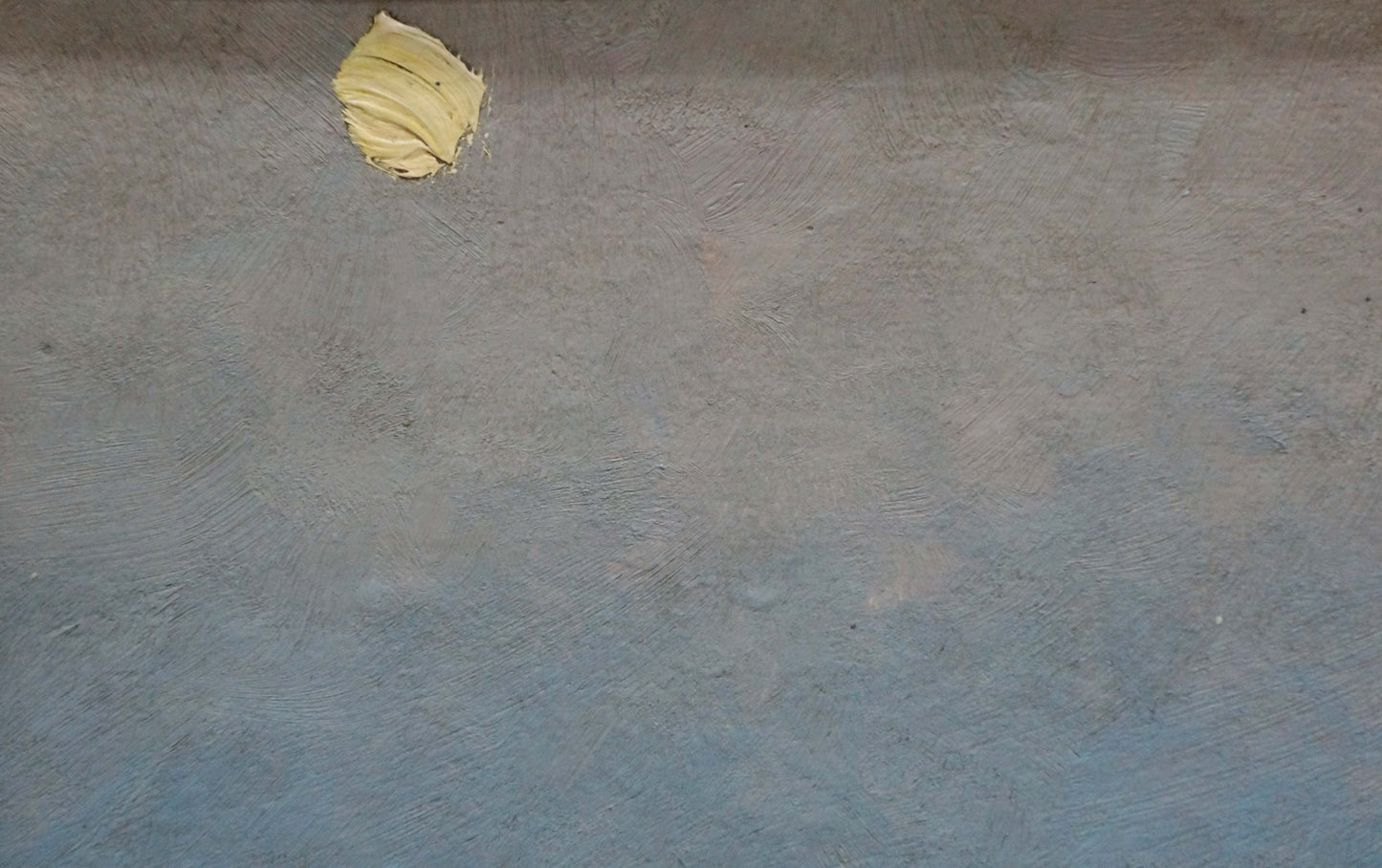 Oil painting of pale yellow butter dollop on blue-gray counter, sunset over sea