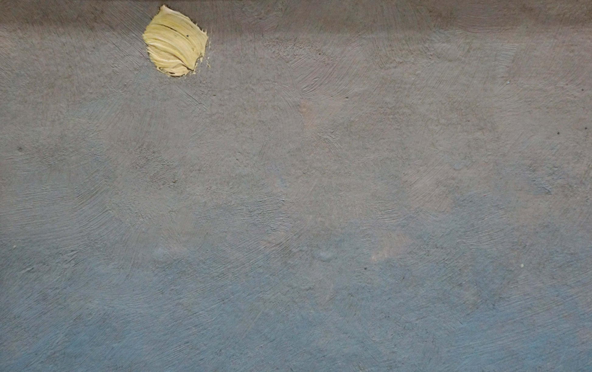 Oil painting of pale yellow butter dollop on blue-gray counter, sunset over sea