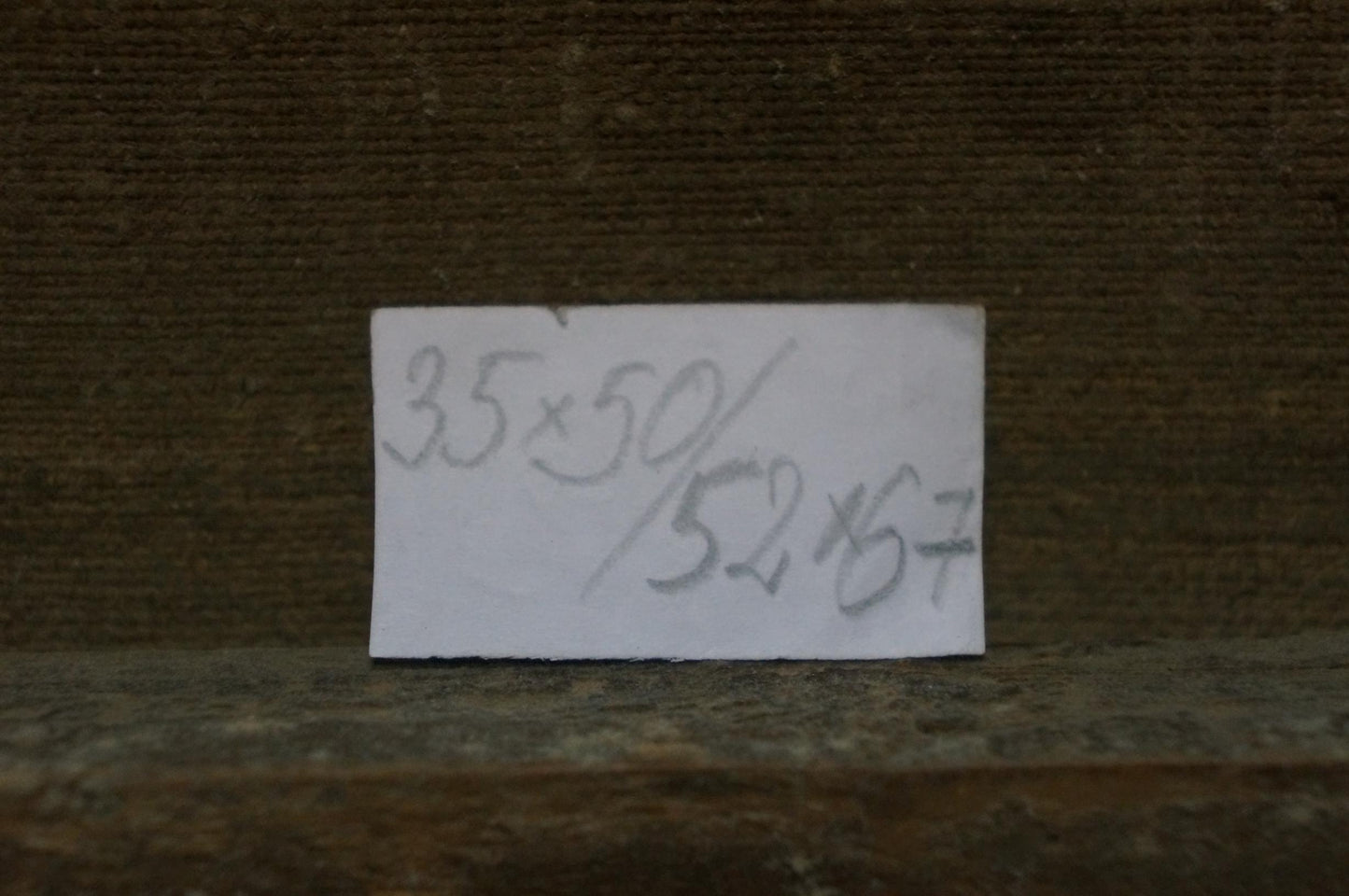 Back of Oil painting Riverbank Fishing Experience label with handwritten measurements
