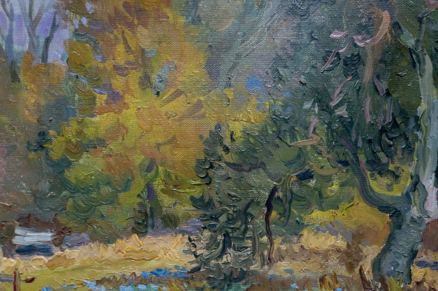 Oil painting of autumn forestscape by unknown artist in vibrant yellows and greens
