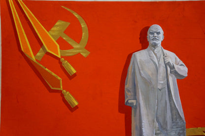 Painting portrait of Lenin: gray-suited figure with golden hammer and sickle on red background