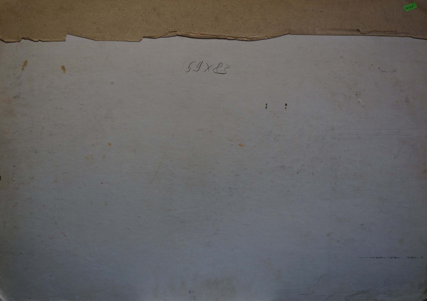 Back of off-white paper with torn edge and faint markings from Lenin portrait