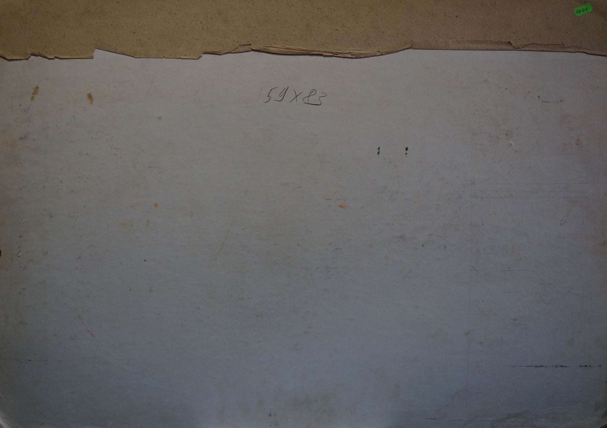 Back of off-white paper with torn edge and faint markings from Lenin portrait