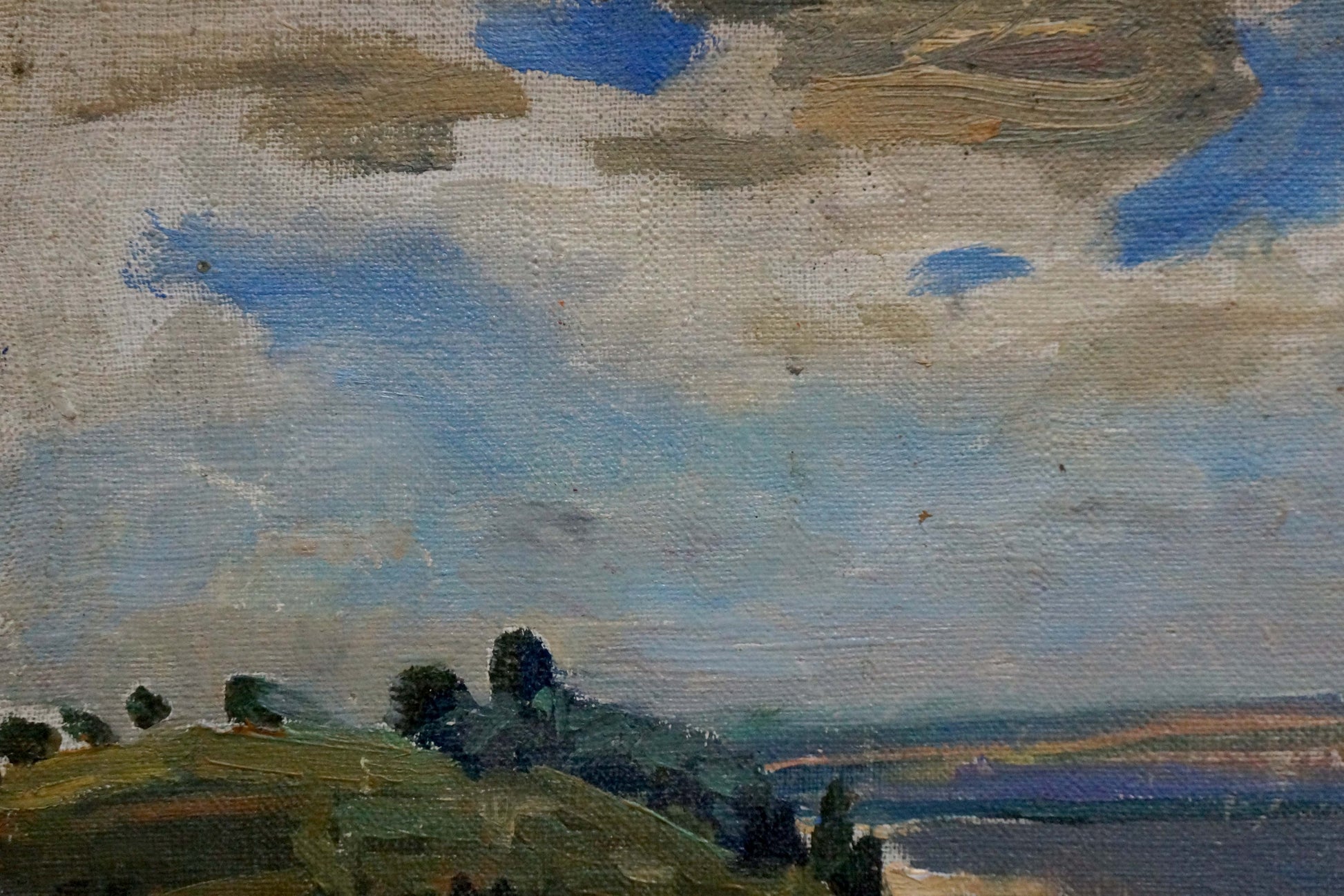 Textured oil painting of soft blue-gray cloudy sky over rolling green hills in Oil painting Landscape of the plains