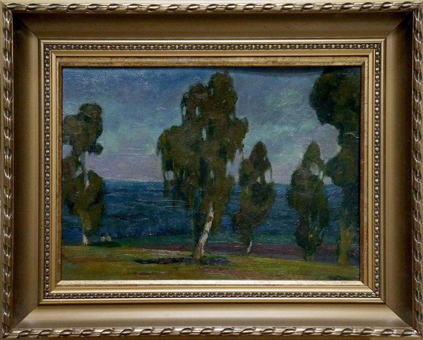Ornate gold-framed oil painting of serene coastal woods at twilight by unknown artist
