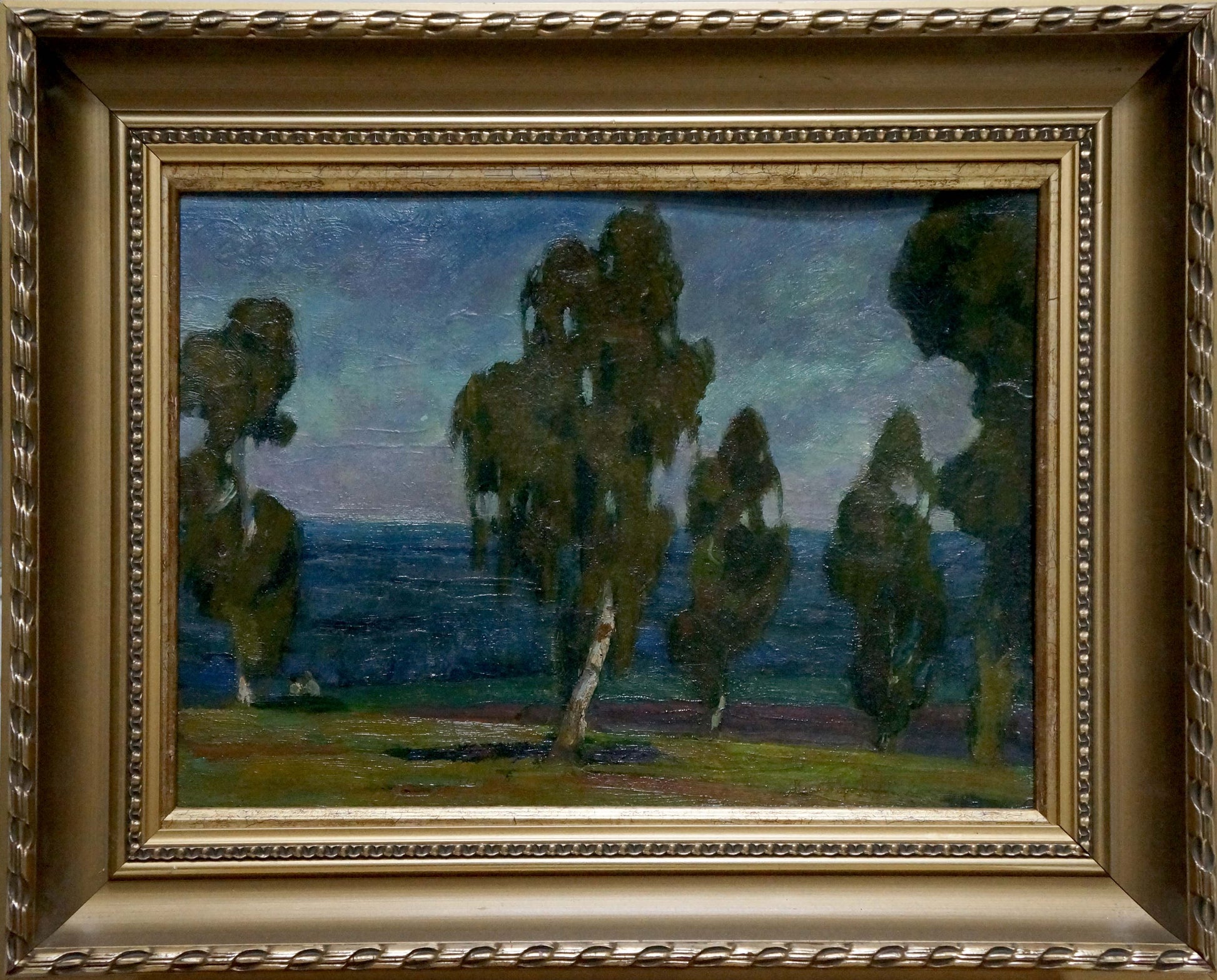 Ornate gold-framed oil painting of serene coastal woods at twilight by unknown artist