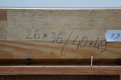 Back of oil painting In the woods: light brown plank with handwritten measurements and white label