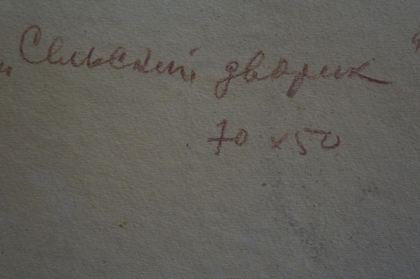 Faded cursive handwriting on textured gray back of Sidorov oil painting