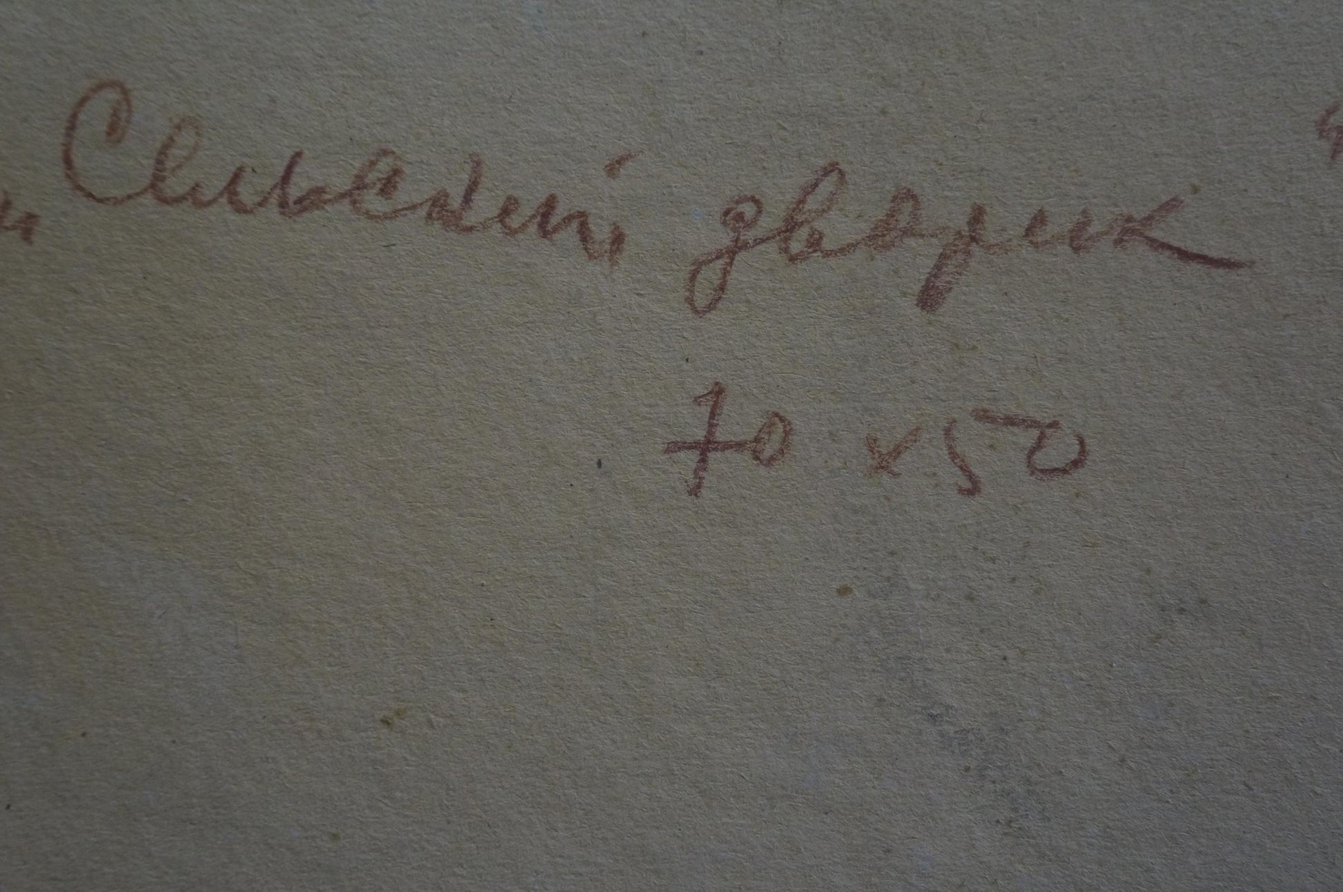 Faded cursive handwriting on textured gray back of Sidorov oil painting