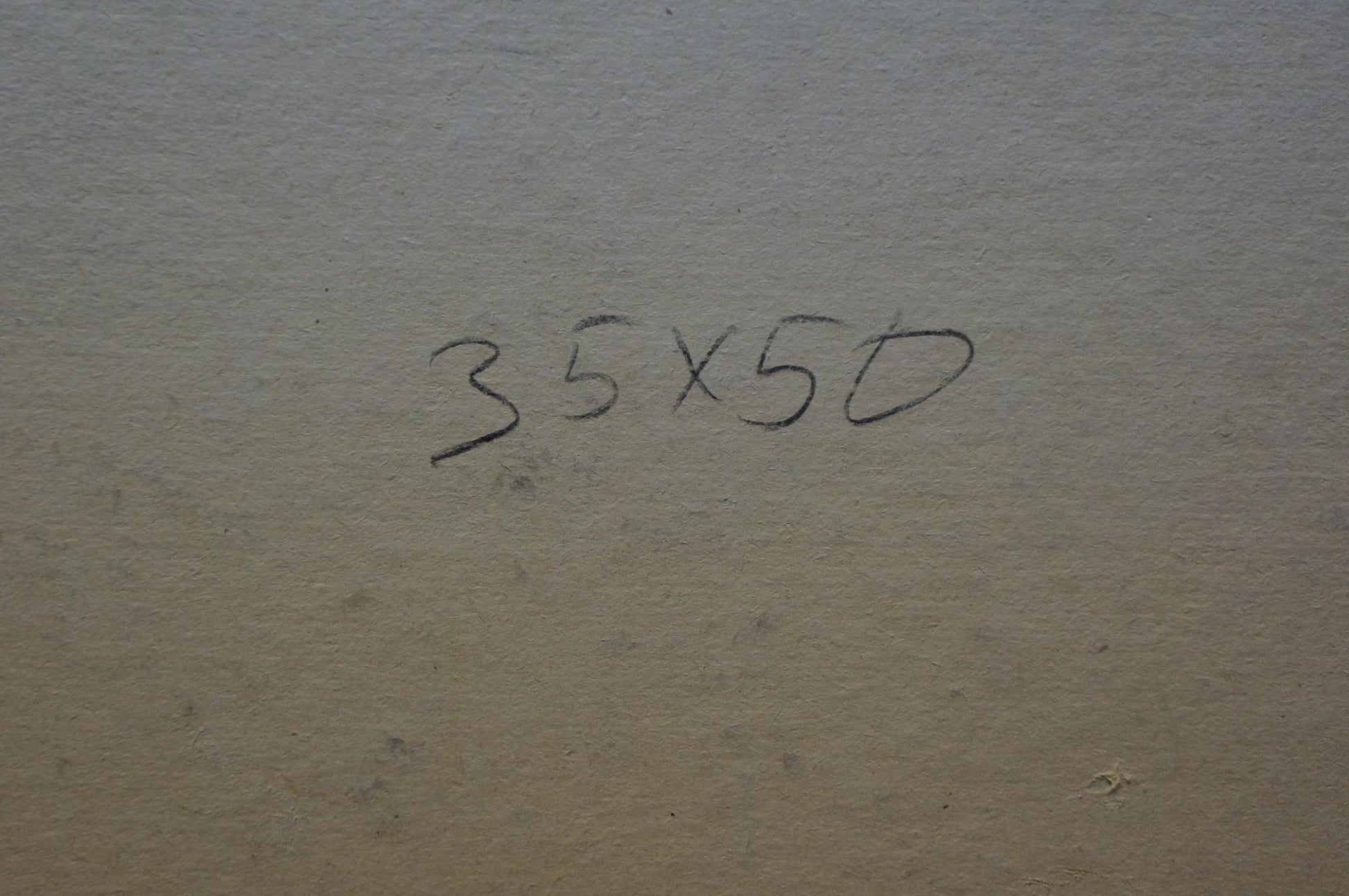 Handwritten ’35x50’’ in black ink on a textured, beige-colored surface.