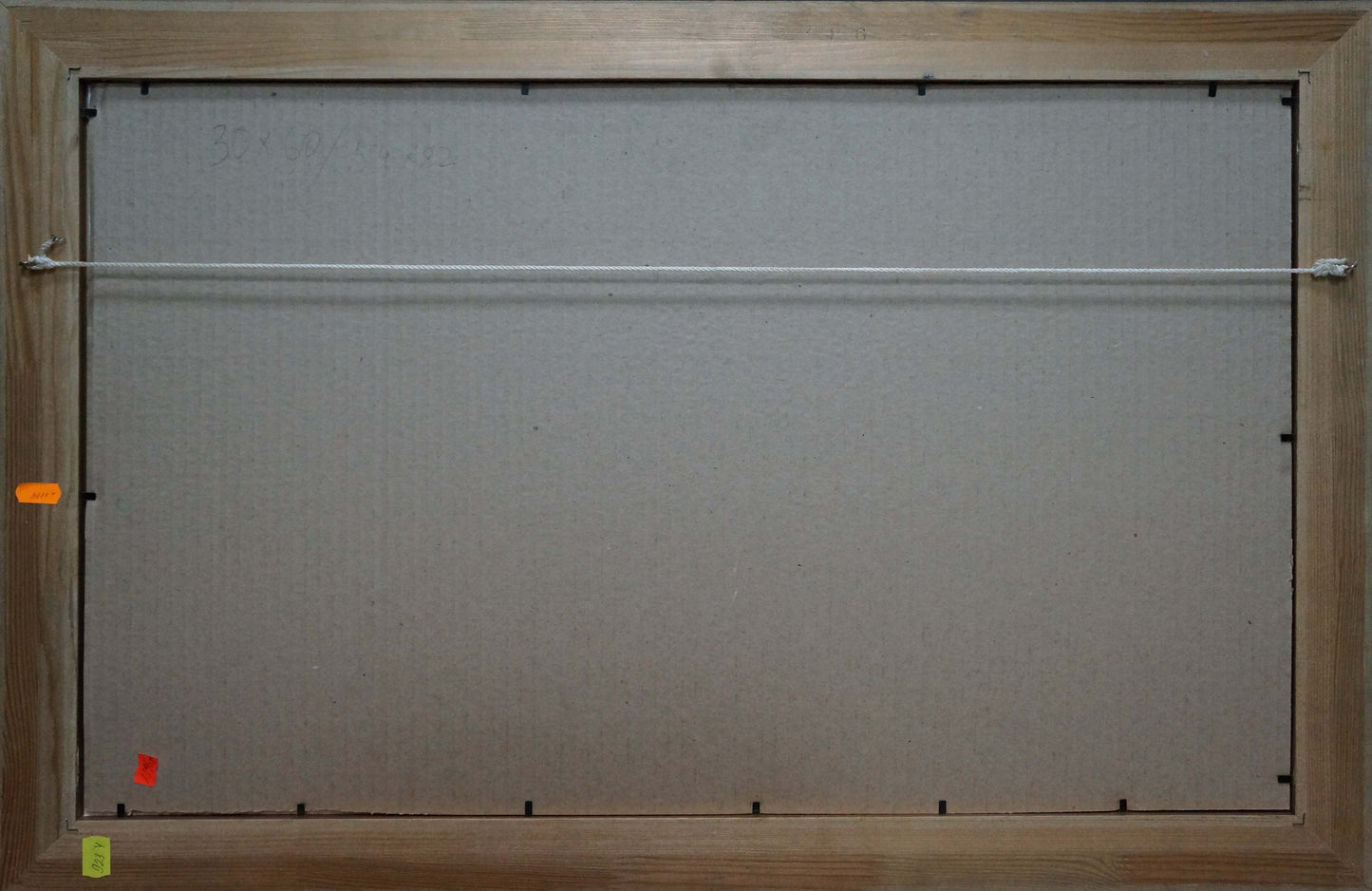 Back of Oil painting After the rain Snopok A.N. light brown wood frame gray backing white wire