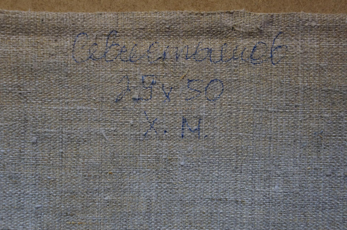 Back of Sevastyanov Viktor Grigorievich oil painting with faded gray Cyrillic textile