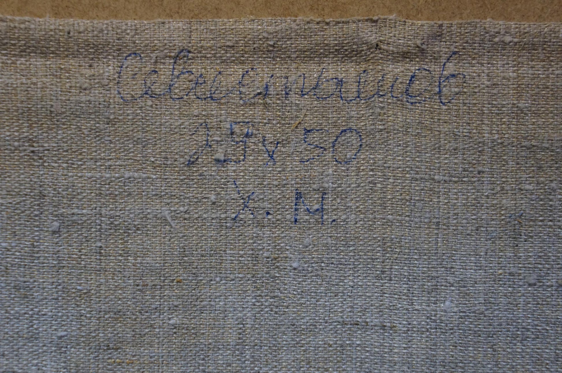 Back of Sevastyanov Viktor Grigorievich oil painting with faded gray Cyrillic textile