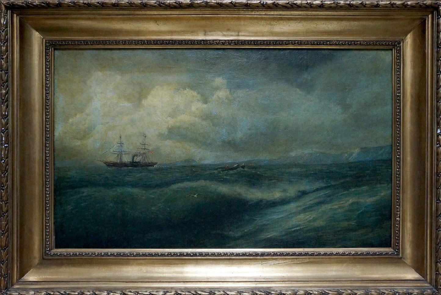 Antique gold-framed oil painting of raging sea with dark ship in storm
