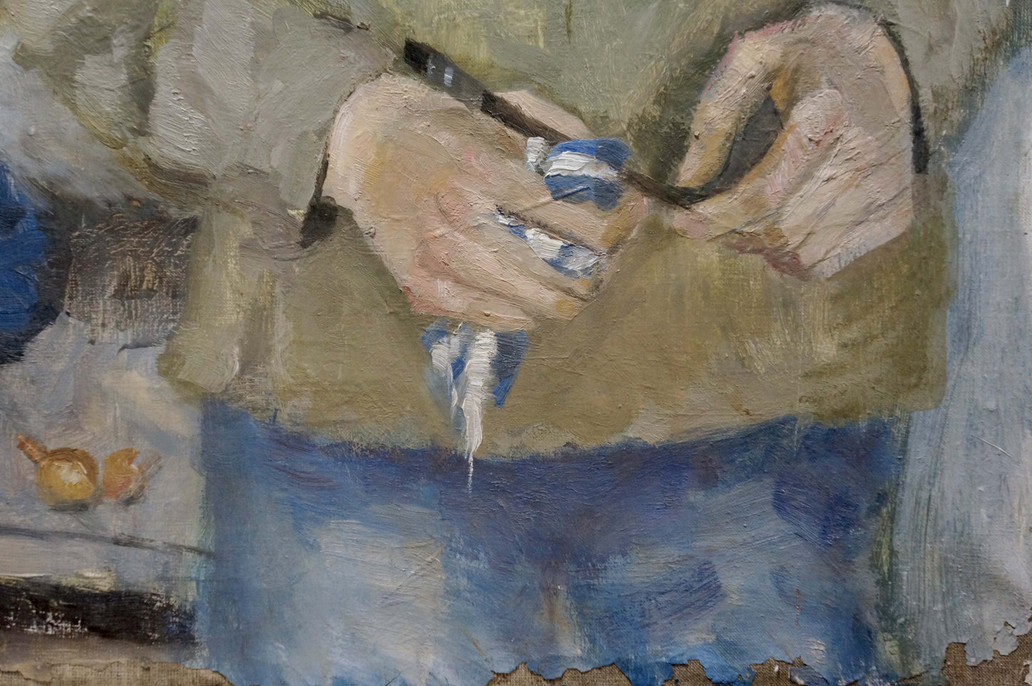 Painter’s hand holding black brush dripping blue white paint by Klimovitskaya Sophia