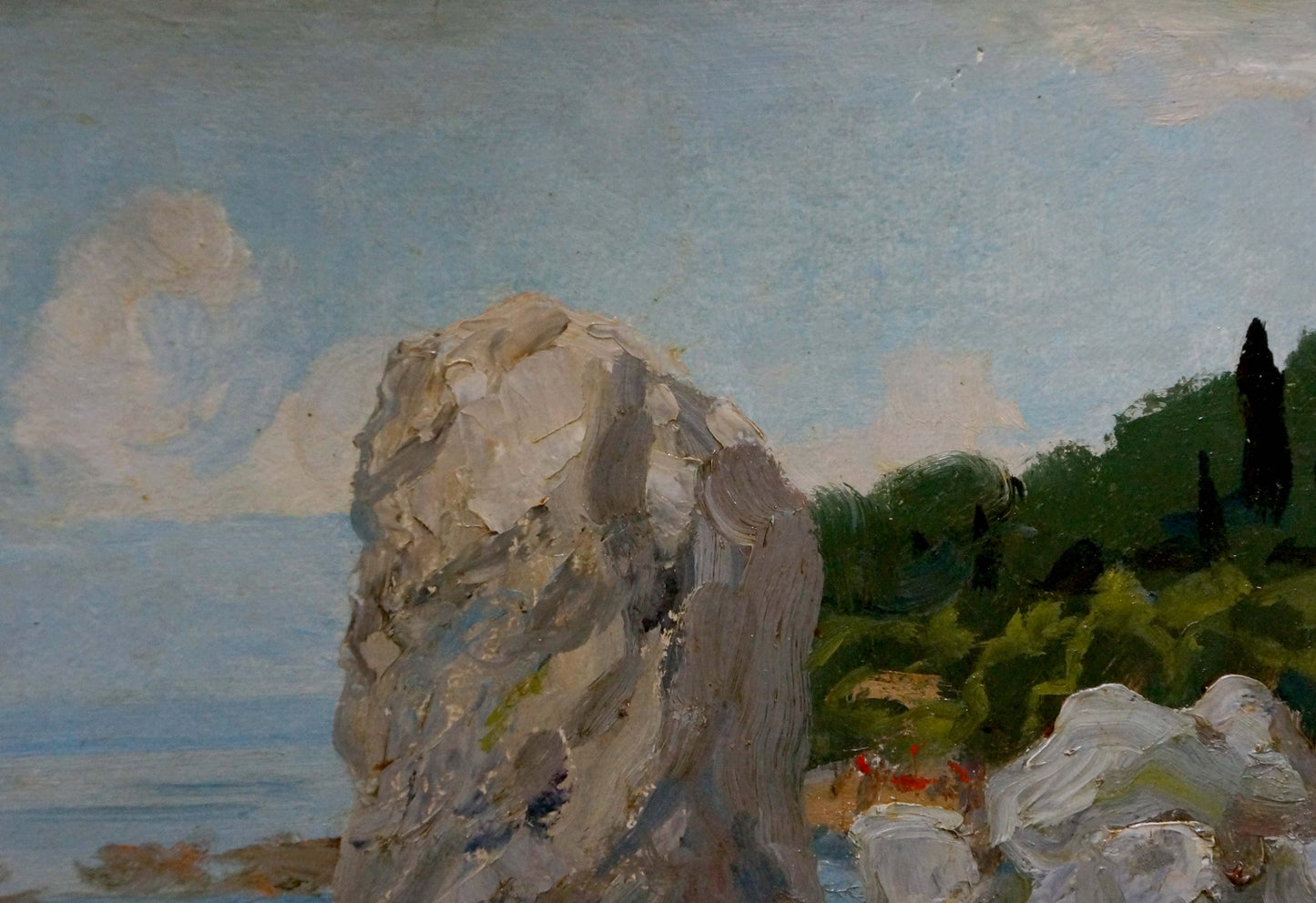 Oil painting of textured gray rock formation on summer seashore