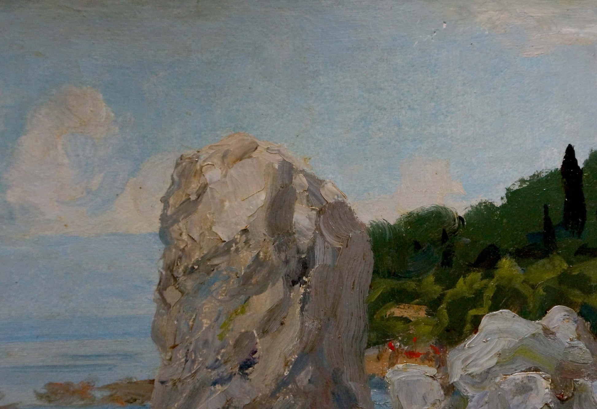 Oil painting of textured gray rock formation on summer seashore