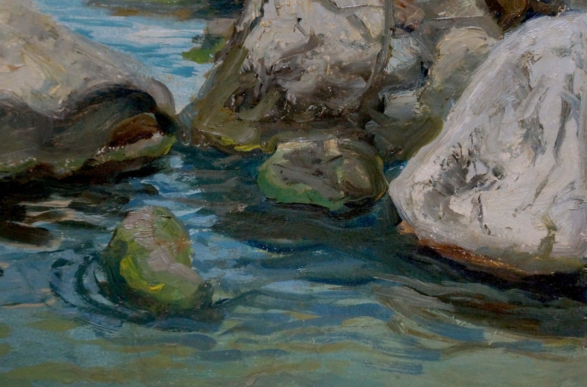Oil painting of rough grayish-white rocks with green brown patches in clear blue summer seashore water