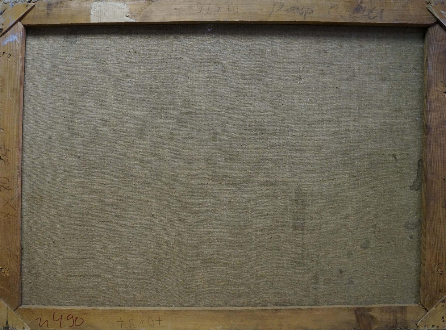 The back of a wooden-framed canvas with a textured, beige linen backing and visible signs of wear.