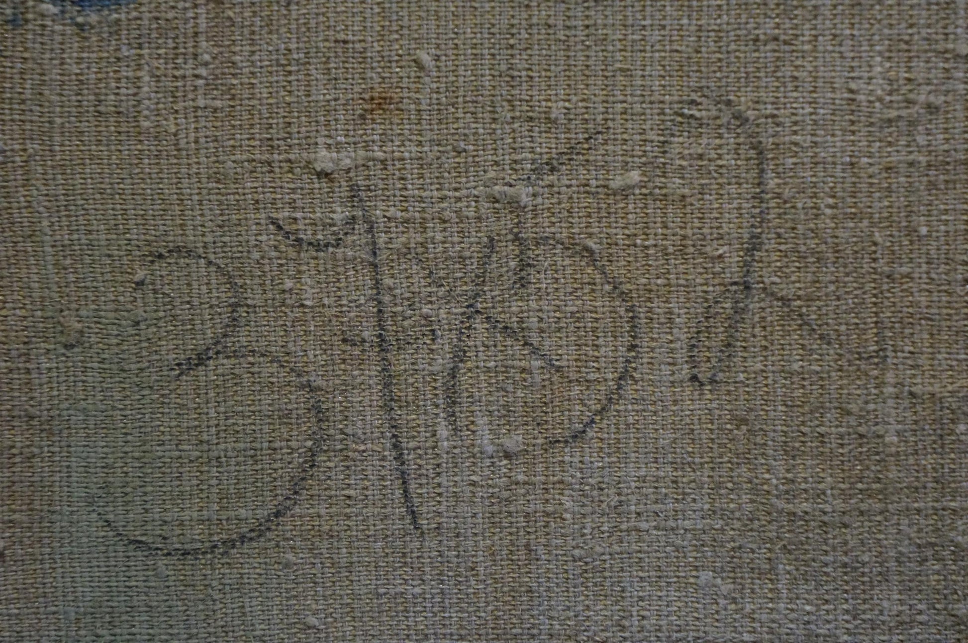 Faded black ink signature by Lomykin Konstantin Matveyevich on beige canvas back