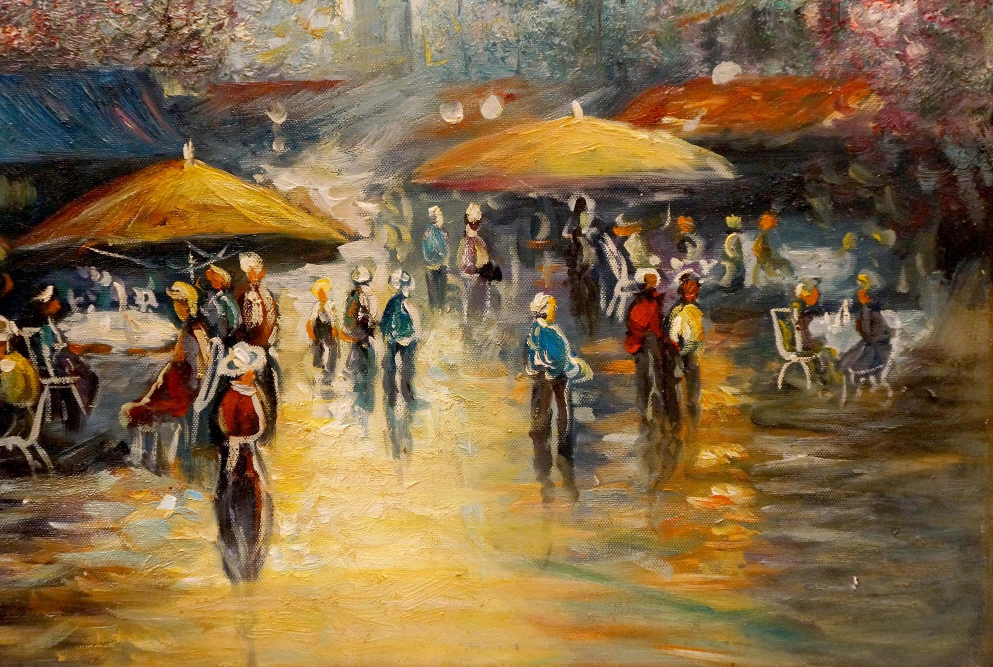 Vibrant impressionist café scene with people resting under yellow umbrellas