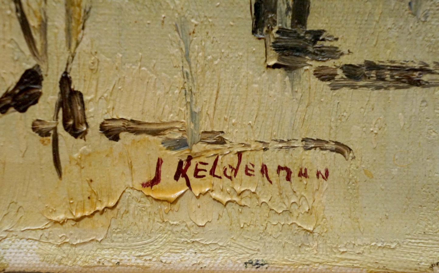 Red cursive Jan Kelderman signature on textured off-white canvas back